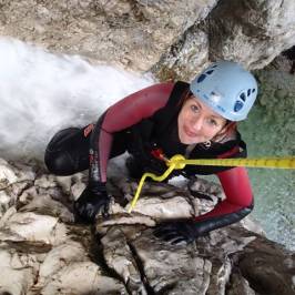 a young boy riding a snow board