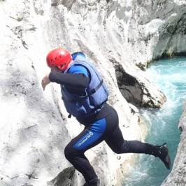 a person riding a snow board in the water
