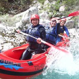 a person riding on the back of a boat