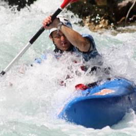 a man riding a wave on top of a body of water