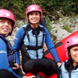 a child wearing a helmet posing for the camera
