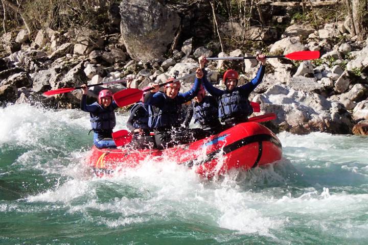 a group of people on a raft in the water