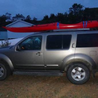 a truck is parked in front of a car