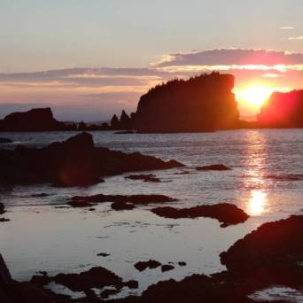 a sunset over a body of water