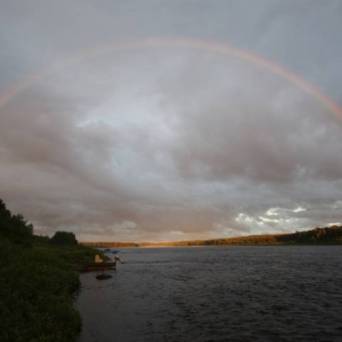 a rainbow over a body of water