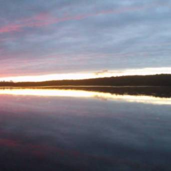 a sunset over a body of water