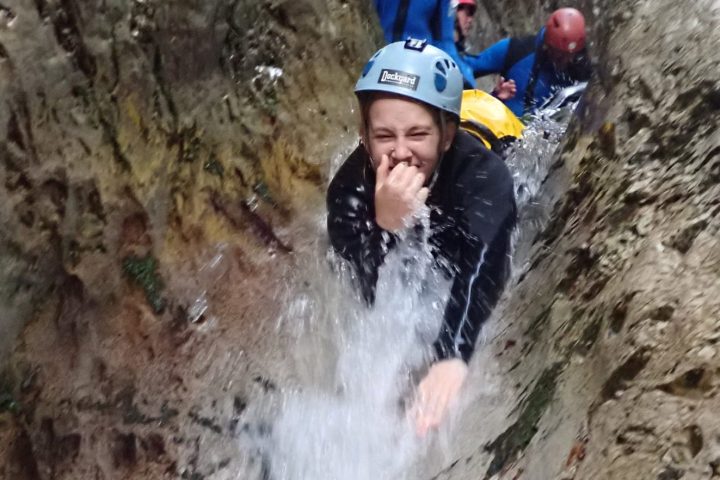 a man riding on the back of a waterfall