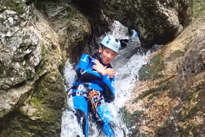 a person riding on top of a rock