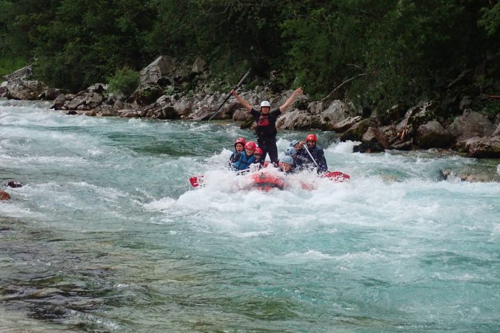 a group of people riding skis on a body of water